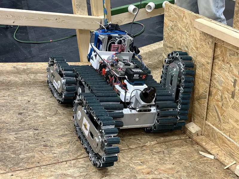 TUBer with its flippers raised inside the plywood test arena